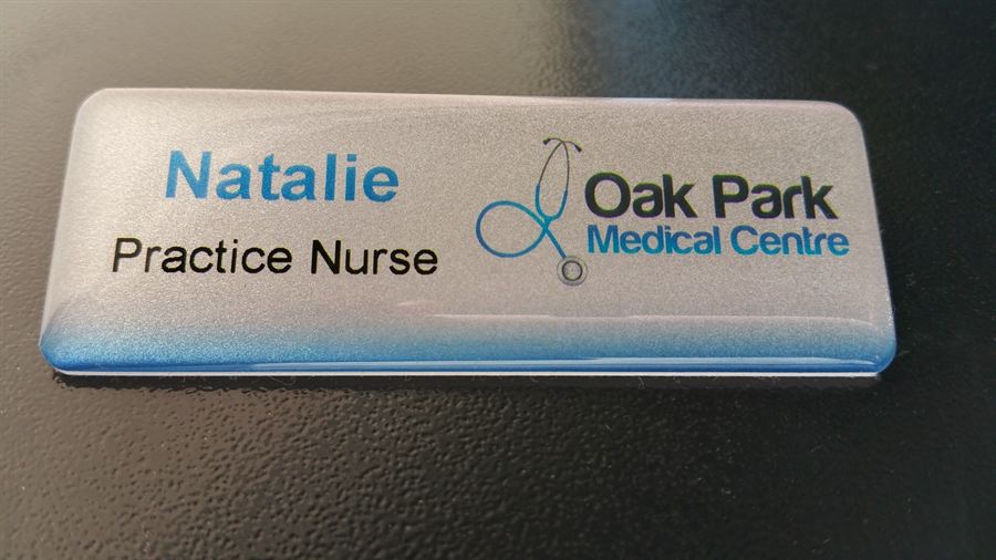 Domed name badge with logo