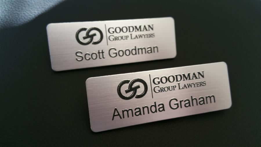 Engraved name badges with logo and text