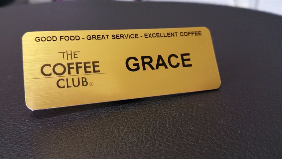 Brushed gold name badge with logo