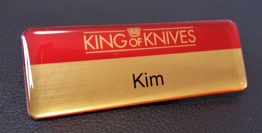 Gold and red domed name badge