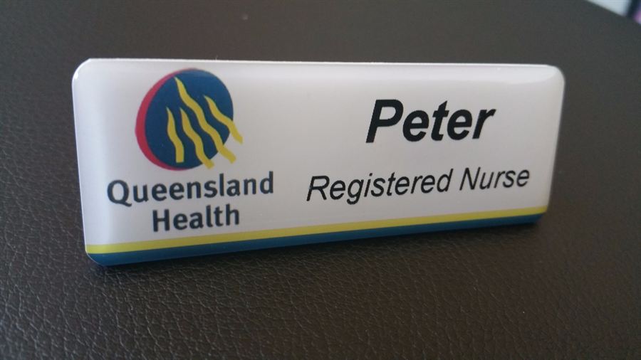 Domed name badge with logo and text