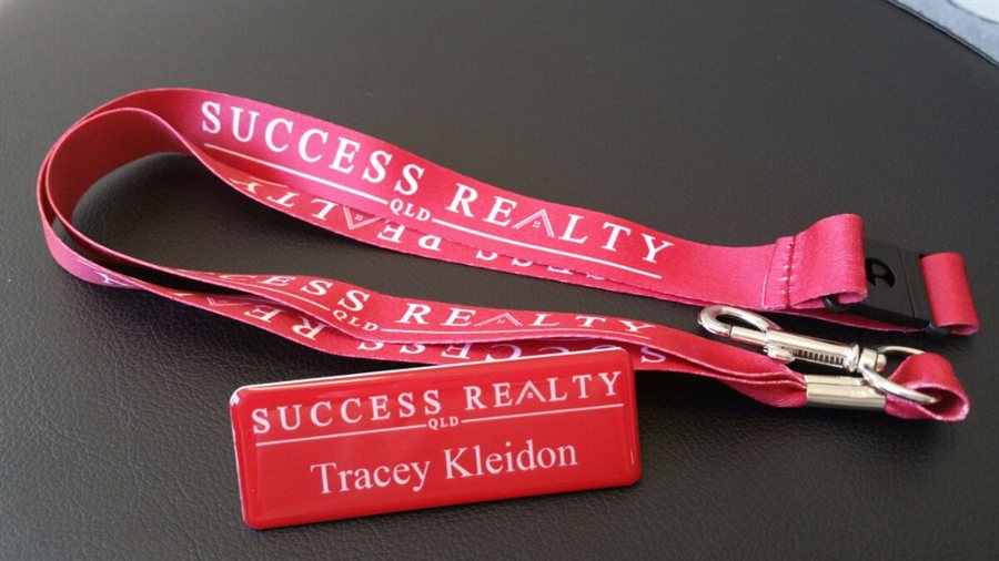 Printed lanyard with a matching domed name badge